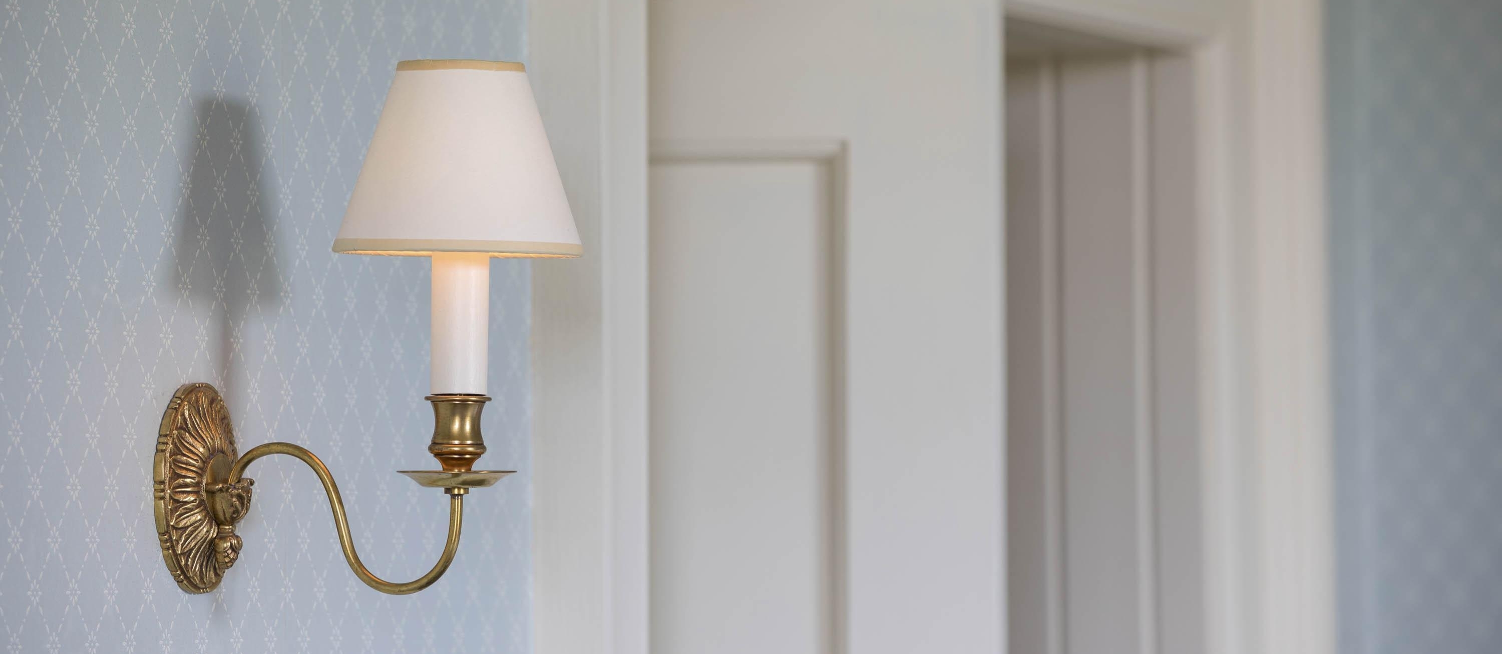 Detail of interior on the Benmore Estate. A wall light with candle-style lamp.